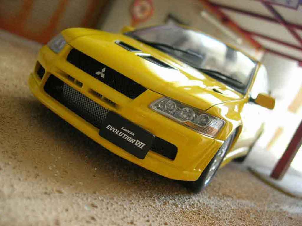 Mitsubishi Lancer Evolution VII geel 1/18 Autoart