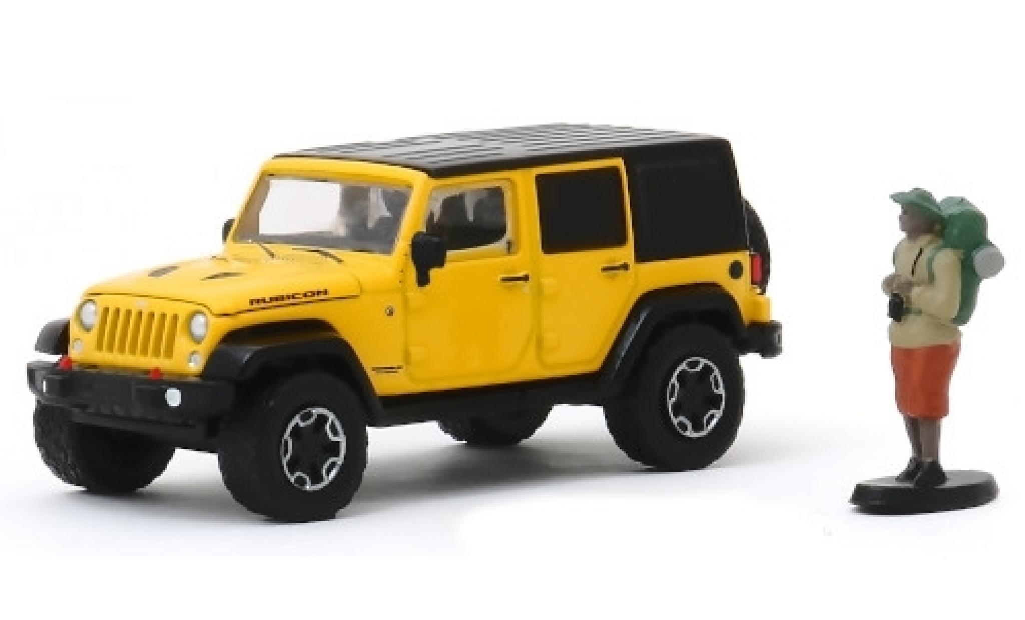 Jeep Wrangler 1/64 Greenlight Unlimited Rubicon Hard Rock geel/zwart 2015 mit Backpackerfigur modelauto