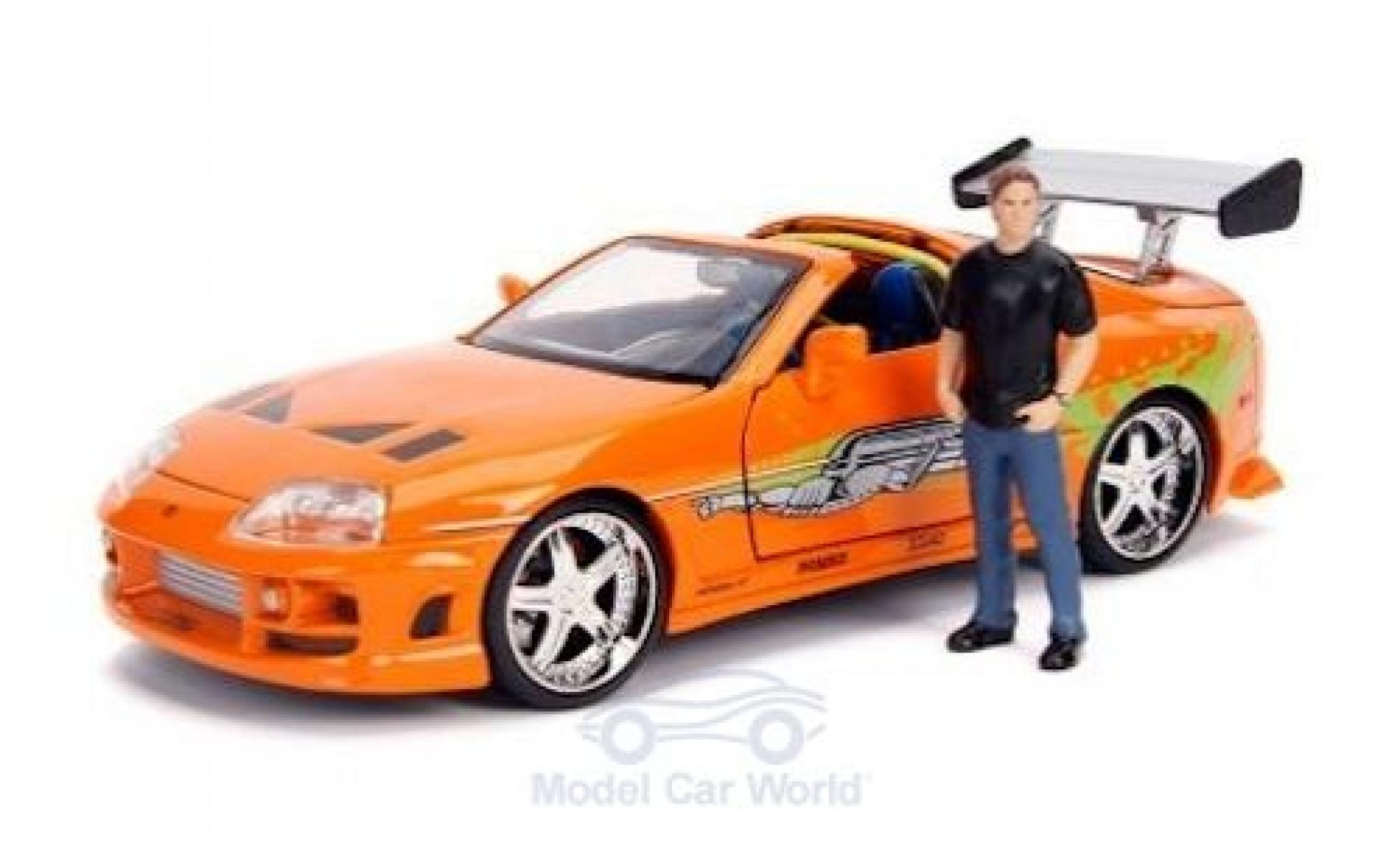 Toyota Supra 1/24 Jada Toys oranje/Dekor Fast & Furious 1995 mit Figur modelauto