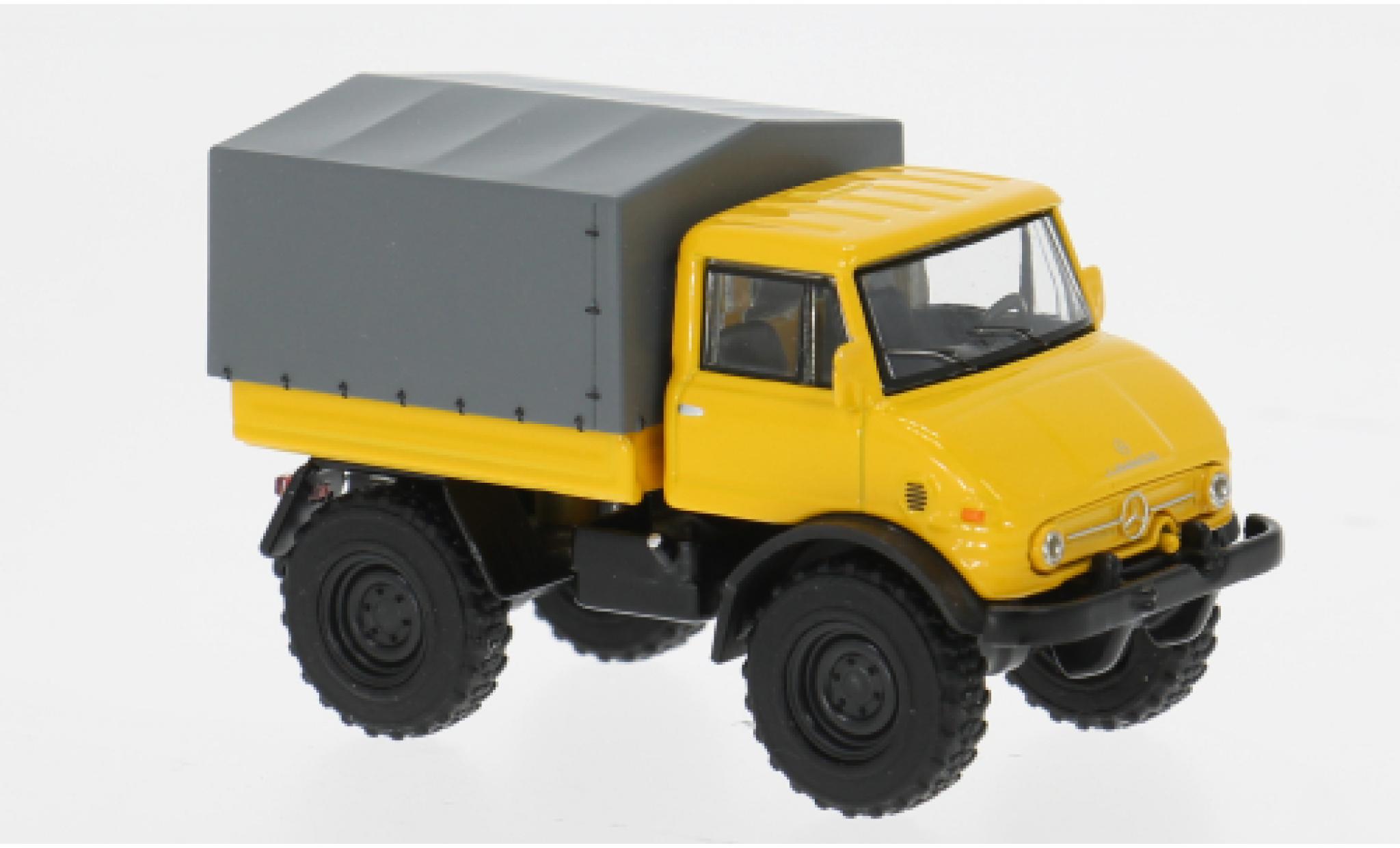 Mercedes Unimog 1/64 Schuco U406 geel/grijs 1:64 modelauto