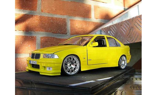 Bmw M3 GTR 1/18 Ut Models E36 sedan rtr geel carlux jantes m3 modelauto