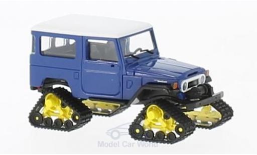 Modelauto Toyota Land Cruiser 40 J4 blauw/wit 1960 met Raupenantrieb 1/87 Busch