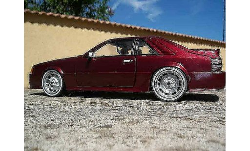 Ford Mustang SVO 1/18 Welly rood modelauto