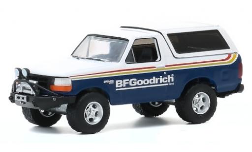 Modelauto Ford Bronco Wagon blauw/wit BF Goodrich 1992 1/64 Greenlight