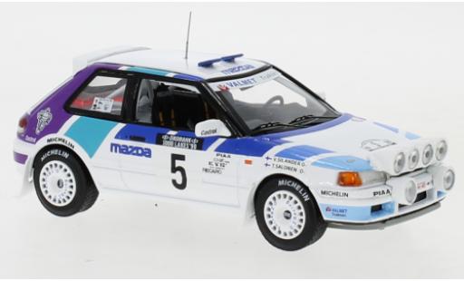 Modelauto Mazda 323 GTX No.5 Rally Team Europe 1000 Lakes Rally 1990 with night lights T.Salonen/V.Silander 1/43 IXO