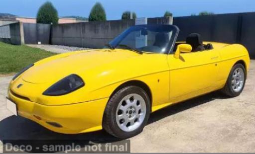 Modelauto Fiat Barchetta Roadster geel 1996 1/18 Norev