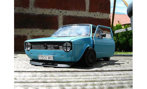 Volkswagen Golf GTI 1/18 Solido blauw jantes ford escort rallye modelauto